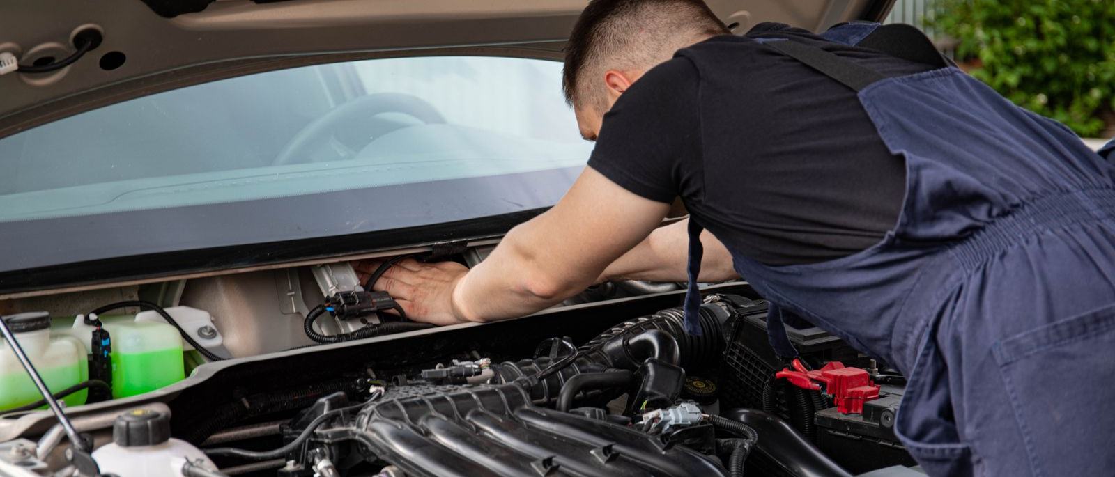 A mechanic at work on a car