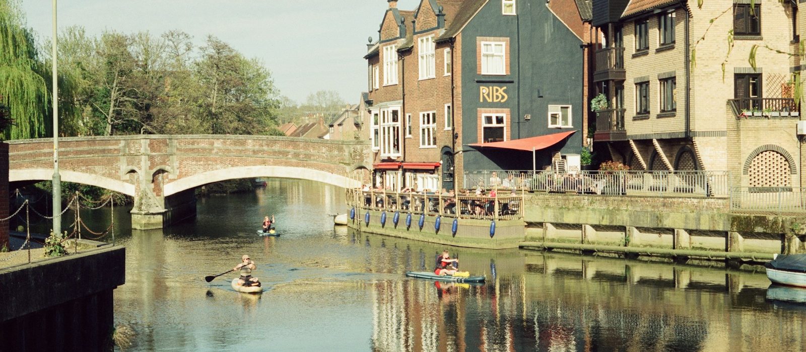 The river in Norwich, with old buildings and a bridge
