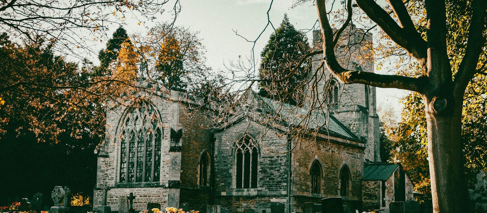 An old stone church in Peterborough on an autumn afternoon
