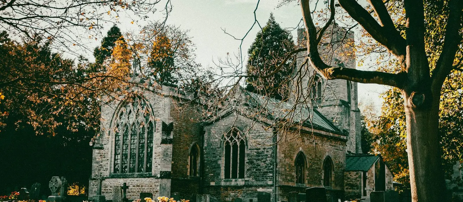 An old stone church in Peterborough on an autumn afternoon