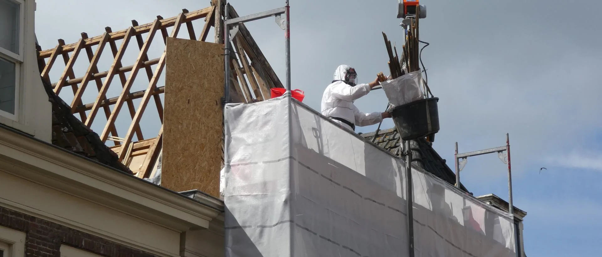 Asbestos removal on a roof, from the Asbestos Specialists UK site
