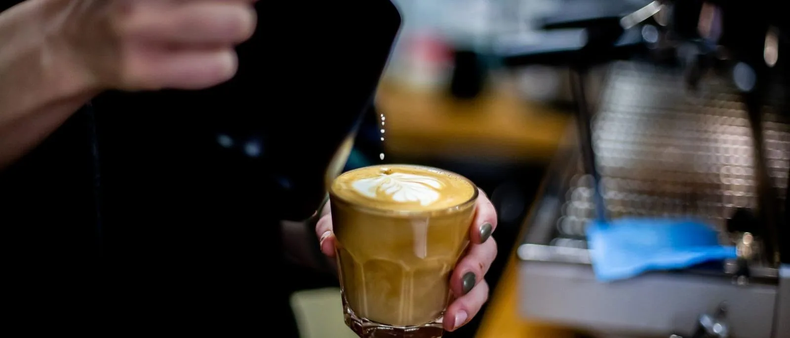 A barista pouring a coffee, from The Bee Hive Cafe site
